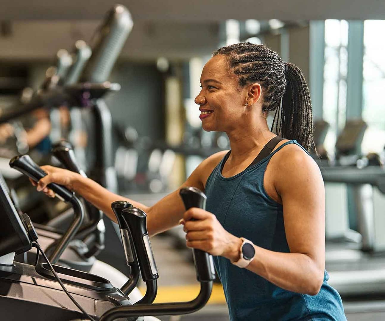 woman working out on elliptical