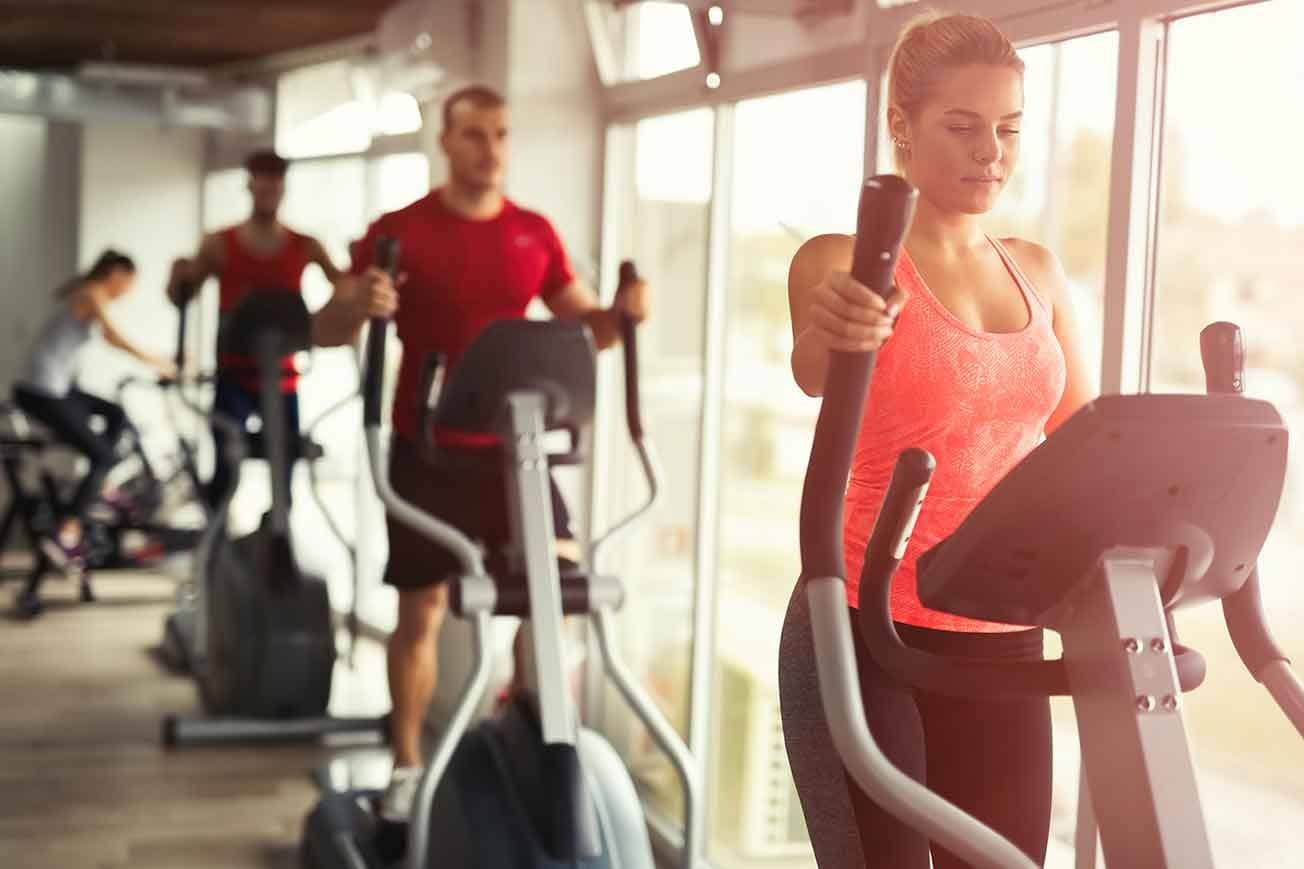 Girl on an elliptical machine