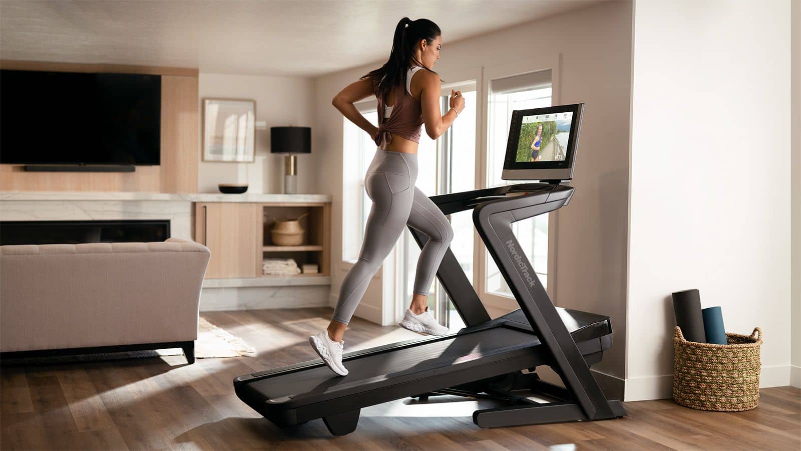 Girl running at home on treadmill