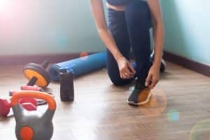 Woman tying shoes for exercise, Healthy lifestyle